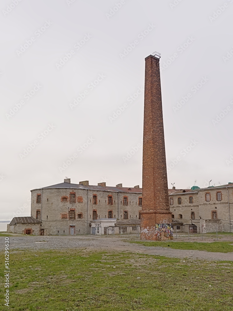 Brick buildings and chimney of Patarei, abandoned Soviet prison on the coast of the Baltic sea in Tallinn, Estonia 
