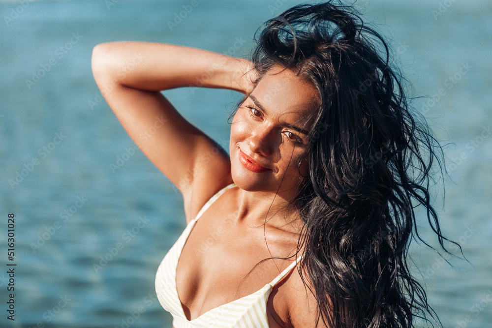 people, summer and leisure concept - happy smiling young woman in bikini swimsuit on beach people, summer and leisure concept - happy smiling young woman in bikini swimsuit on beach