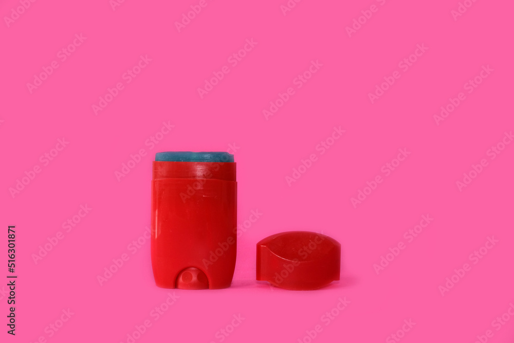 Male deodorant on a bright pink background Male deodorant on a bright pink background