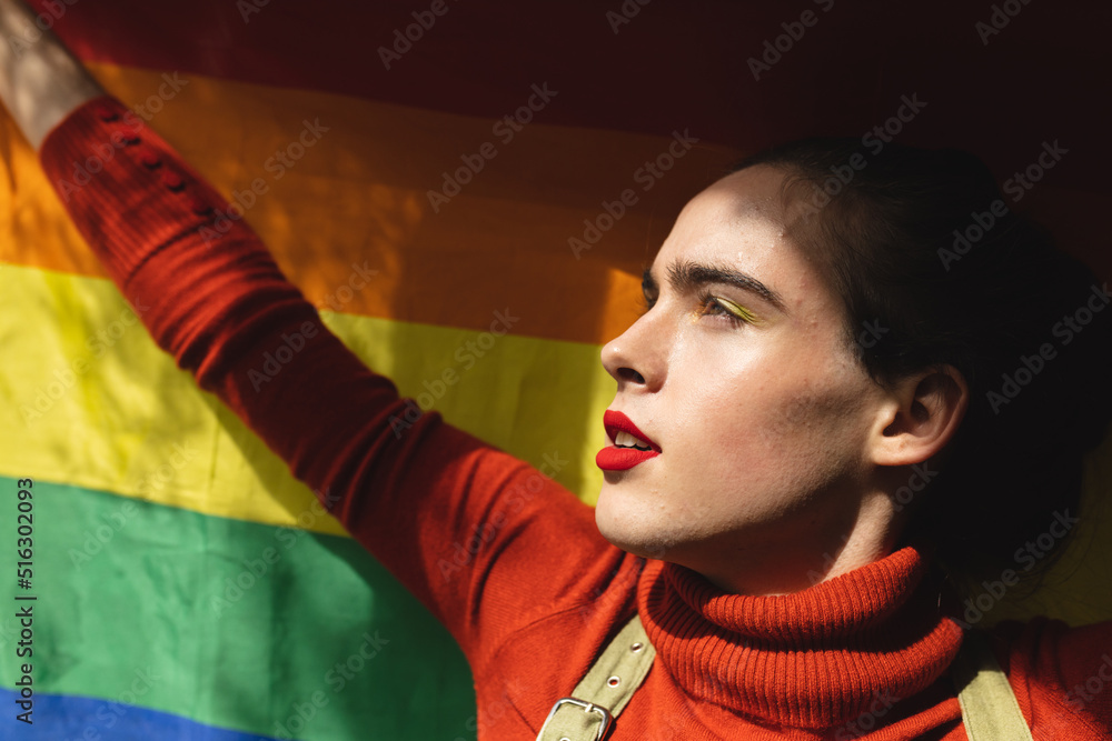 image-of-profile-of-caucasian-non-binary-trans-woman-holding-rainbow