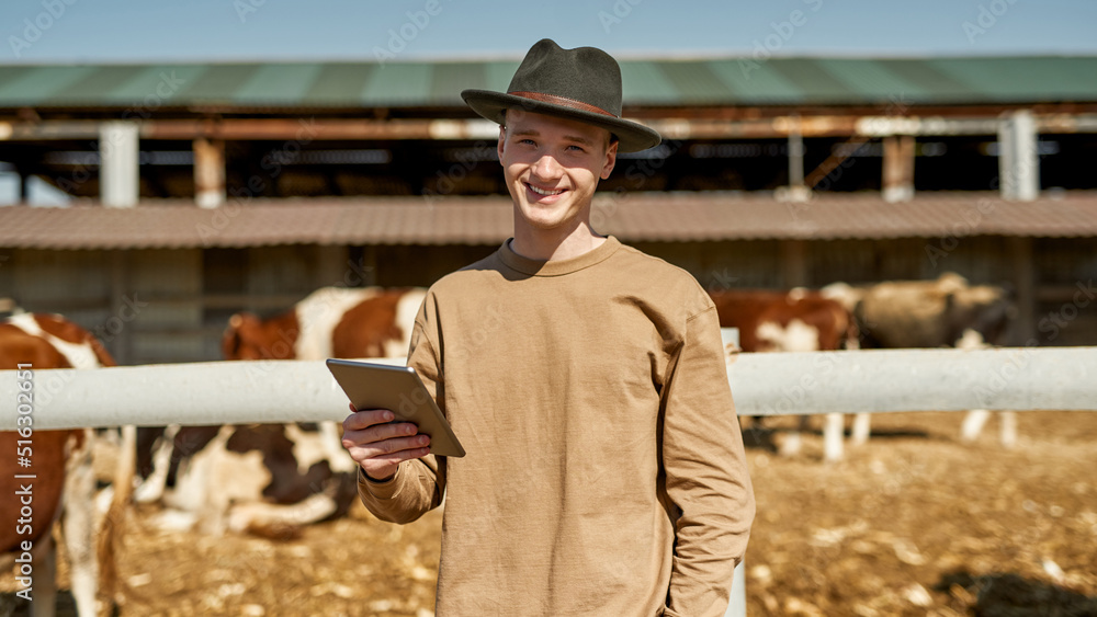 Front of male farmer with digital tablet on farm