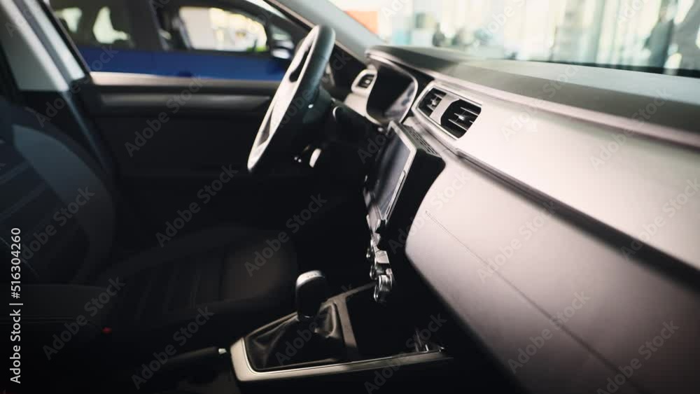 The interior of a new car in the showroom for sale. Car dealer showroom. The interior of a new car in the showroom for sale. Car dealer showroom.
