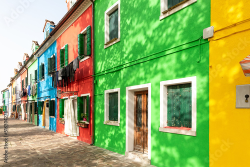 Street with colorful houses on the island of Burano . Italy. © Nataliya