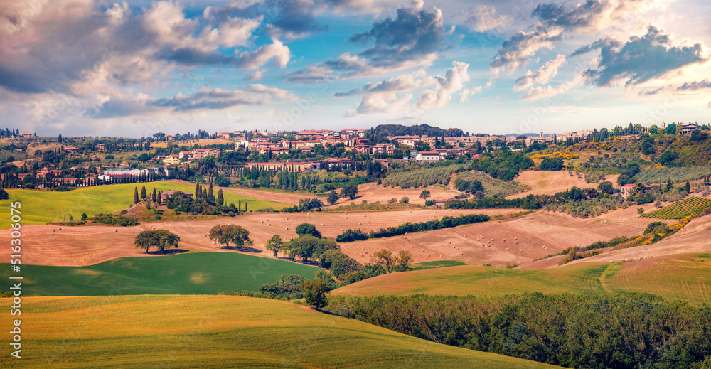 Rural Italian countryside. Panoramic summer view of wheat harvest in Italy, Europe. Traveling concept background.
