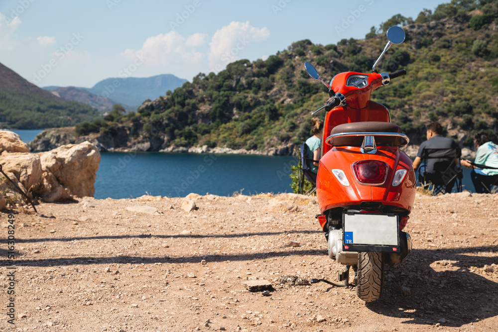 Motor scooter on the background of the sea landscape Motor scooter on the background of the sea landscape