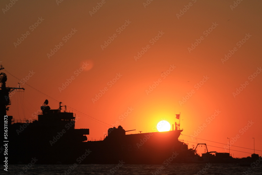 Sunset and silhouette ship