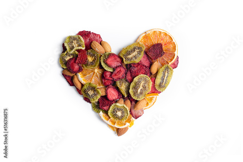 Natural Dried fruit slices snack in heart shape. Dried Strawberry, Kiwi, Oranges for baking. Dehydrated dry fruit. Isolated white background. Love concept, valentines concept. photo