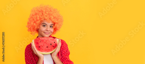 smiling child with orange hair hold water melon slice. yummy juicy watermelon. Summer girl portrait with watermelon, horizontal poster. Banner header with copy space.