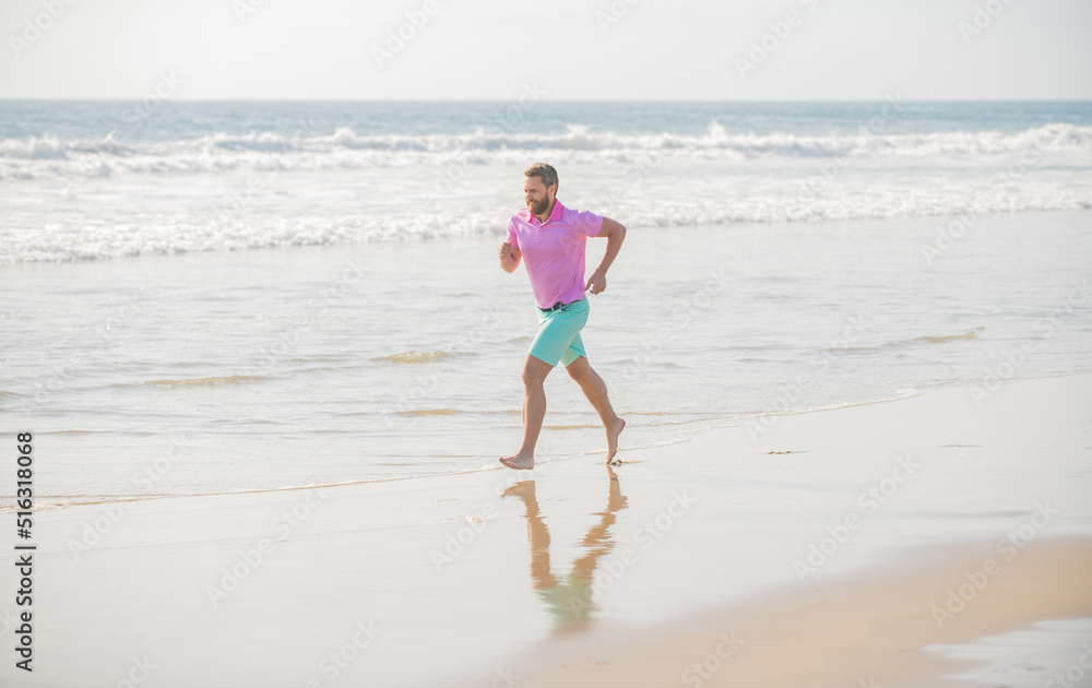 healthy man running on beach. energetic summer. runner feel freedom. enjoying the morning.