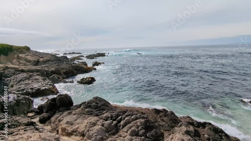 Blue ocean waves hitting rocks at Granite Beach, 17 mile Drive Spanish bay in Monetery, California.