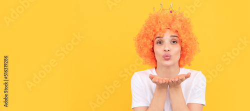 blow a kiss. funny girl in diadem. selfish woman in tiara. pageant. april fools day. freaky girl. Woman isolated face portrait, banner with copy space.