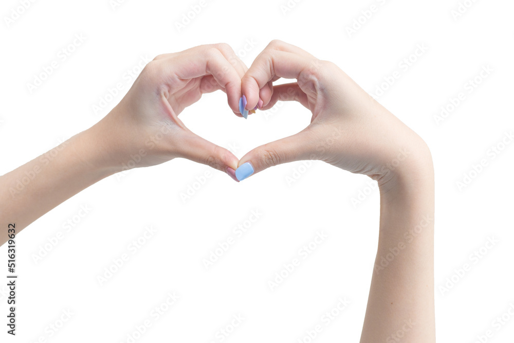 Beautiful female hand shows heart symbol as love sign on a white background in manicure concept. Beautiful female hand shows heart symbol as love sign on a white background in manicure concept.