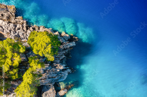 Fototapeta Naklejka Na Ścianę i Meble -  Croatia. Aerial view on rocks and forest. Vacation and adventure. Rocks and turquoise water. Top view from drone at beach and blue sea. Landscape from air. Travel image.