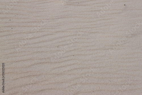 wind blown sand waves on beach