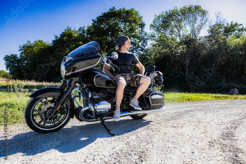Mid aged man sitting on big motorcycle © crazyALEX.de GmbH