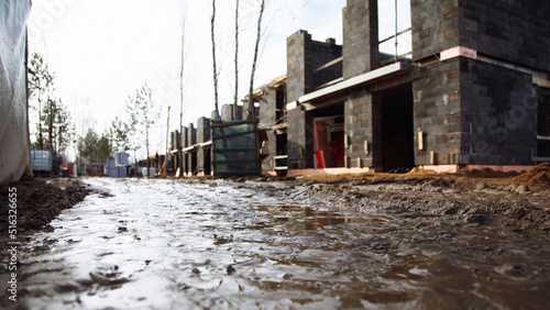 mud and slush on the construction site of designer private homes