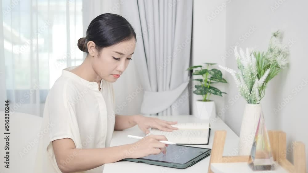 Women working on digital tablets in the new normal and read books Women working on digital tablets in the new normal and read books
