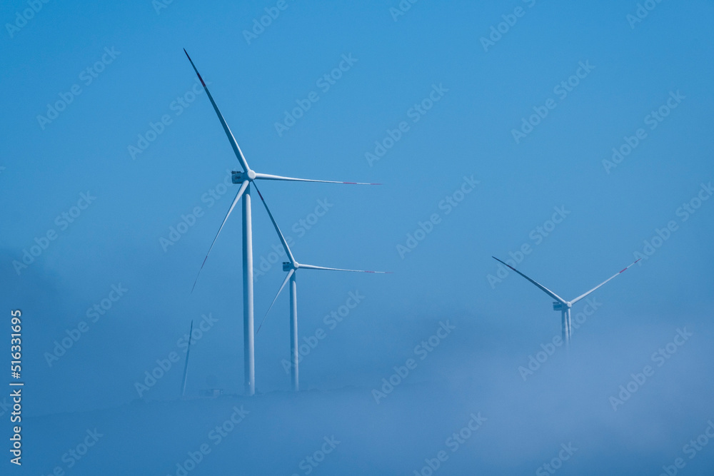 Fototapeta premium Wind Turbines in The Fog