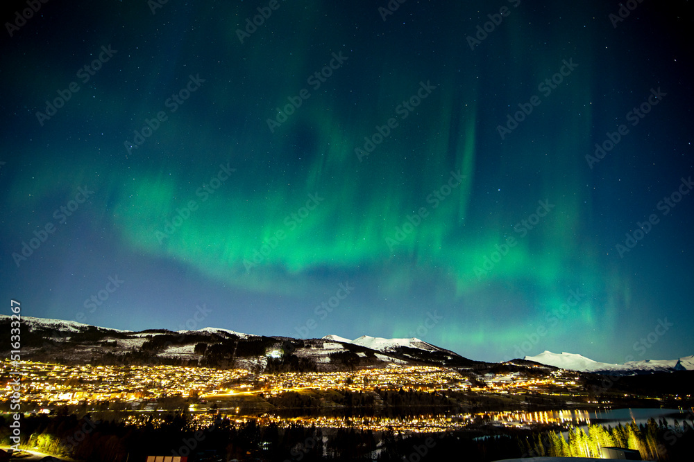 Northern lights in norway above the city of Volda