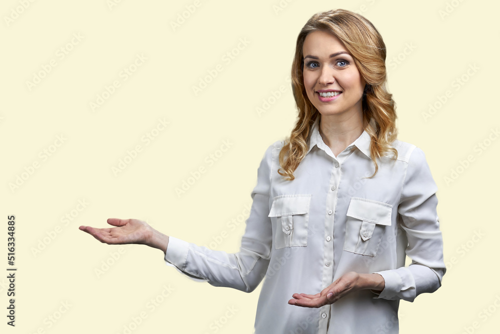 Portrait of elegant young woman showing copy space. Isolated on white background. Advertising concept. Portrait of elegant young woman showing copy space. Isolated on white background. Advertising concept.