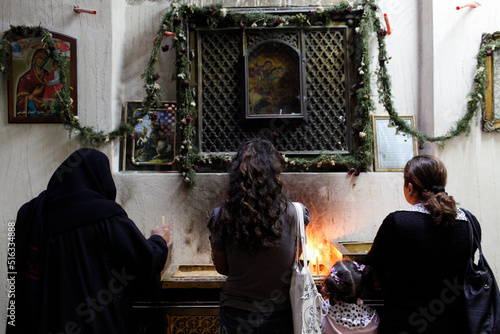 Women praying in Saint George coptic orthodox church photo