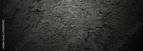 Brush scratches on the wall. Scary dark walls, slightly light black concrete cement texture for background.
