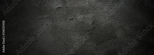 Brush scratches on the wall. Scary dark walls, slightly light black concrete cement texture for background.