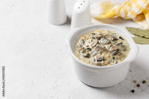 Creamy vegetable mushroom sauce in pot. Top view, copy space.