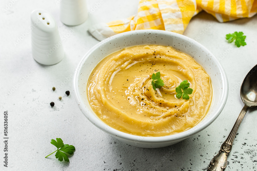 Turmeric split pea mash with herbs and olive oil. Top view, copy space, flat lay. Turmeric split pea mash with herbs and olive oil. Top view, copy space, flat lay.
