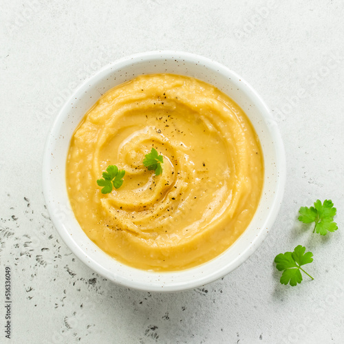Instant pot split pea puree with herbs and olive oil. Top view, copy space, flat lay.