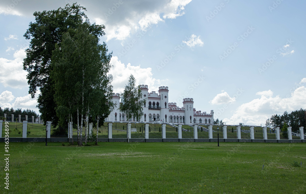 Kossovo Palace Complex, Republic of Belarus. White castle in the greenery.