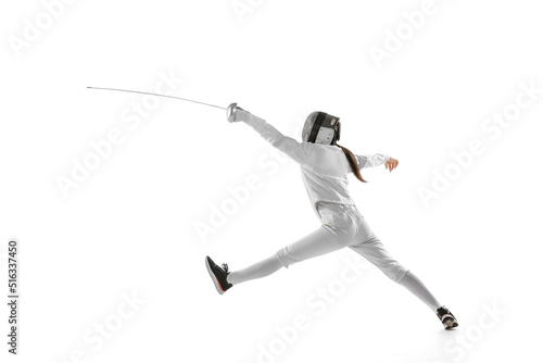 One sportsman, female fencer in white fencing costume in action, motion isolated on white background. Sport, youth, hobbies, achievements, goal.