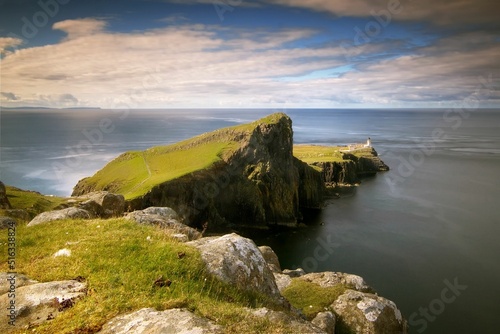 Scenic view of Neist Point lighthouse on the coast of the Isle of Skye, Scotland photo