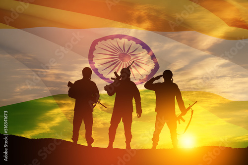Silhouettes of soldiers on a background of India flag and the sunset or the sunrise. Greeting card for Independence day  Republic Day. India celebration.