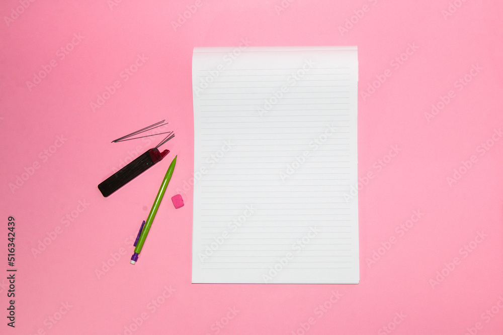 blank white paper and pencils next to it on a pink background, creative art design, copy space, back to school blank white paper and pencils next to it on a pink background, creative art design, copy space, back to school