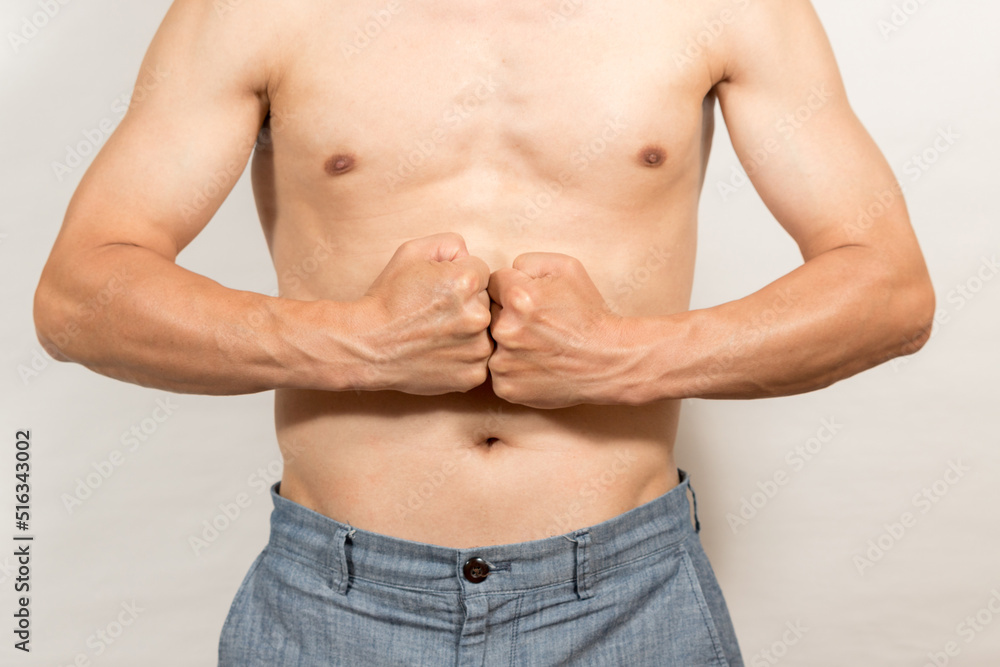 Naklejka premium お腹の脂肪に気になるダイエットする男性の姿