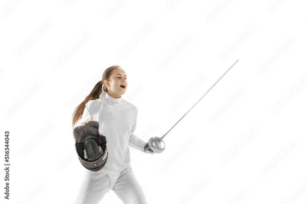 Young girl, fencer in white fencing costume posing with rapier isolated on white background. Sport, youth, hobbies, achievements, goal. Young girl, fencer in white fencing costume posing with rapier isolated on white background. Sport, youth, hobbies, achievements, goal.