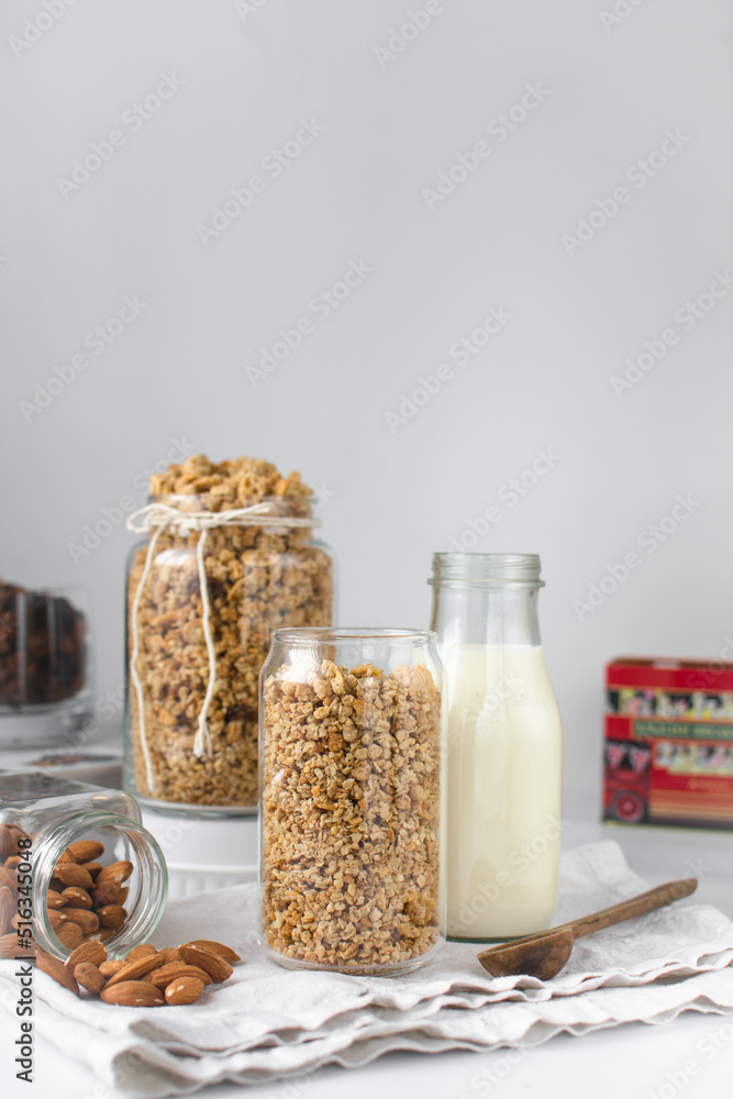 Granola in a can shaped glass, oats and nuts, toasted honey granola in can glass cup Granola in a can shaped glass, oats and nuts, toasted honey granola in can glass cup