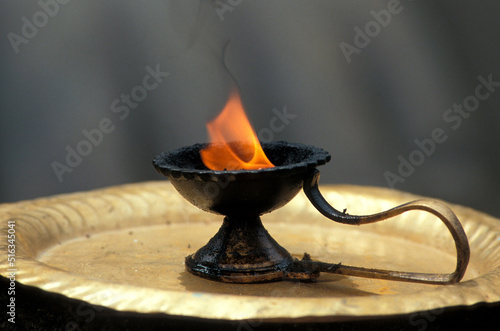 Jain sacred fire at the feet of the giant statue of Gomateshwara at Shravanabelagola