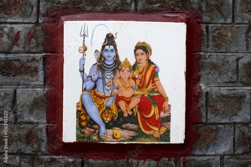 Shiva's family depicted on ceramic tile on a wall in Rishikesh © Julian