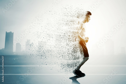 Foto Sportsman running be scattering particles on track