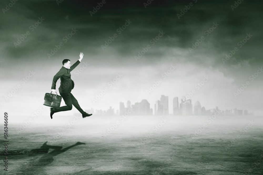 Businessman run fast with misty city background Businessman run fast with misty city background