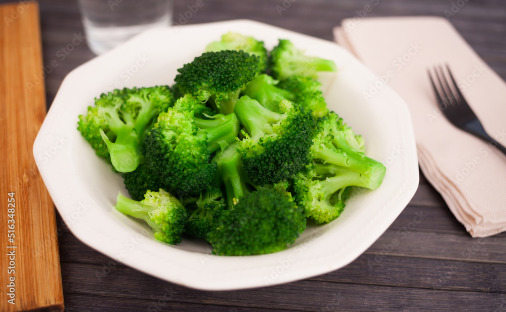 diet food. steamed broccoli on plate diet food. steamed broccoli on plate
