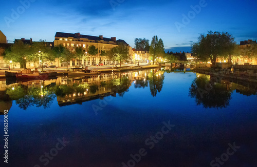 Pond or canal in Nantes  , reflection, in water , Blue sky Early May.  © Marat Lala