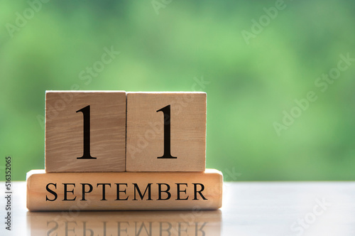 September 11 calendar date text on wooden blocks with copy space for ideas. Copy space and calendar concept photo