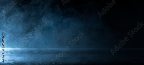 Empty dark abstract cement wall and studio room with smoke float up the interior texture for display products wall background.