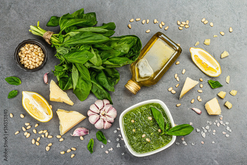 Pesto sauce in a bowls with pine nuts, parmesan and garlic. Traditional Italian food