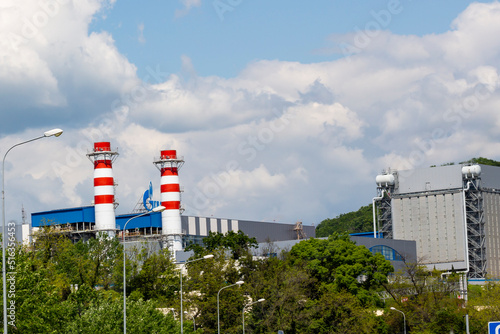 ADLER, RUSSIA - MAY 10, 2022: pipes of the Gazprom gas company on the roof of a thermal power plant. photo
