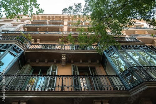 Fotografija Classic apartment building with balconies and shutters in Barcelona