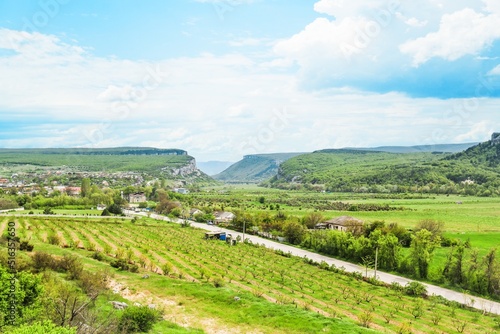 Wallpaper Mural Panoramic view of a summer evening in the mountains, green meadows, mountain and hills Torontodigital.ca